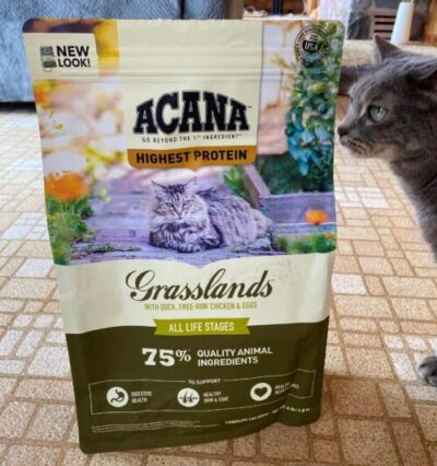 Bag of Acana Grasslands and cat next to it